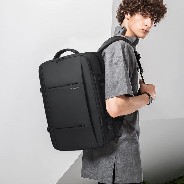 Grey unisex travel backpack, 26-45L, with secure laptop sleeve & waterproof material.