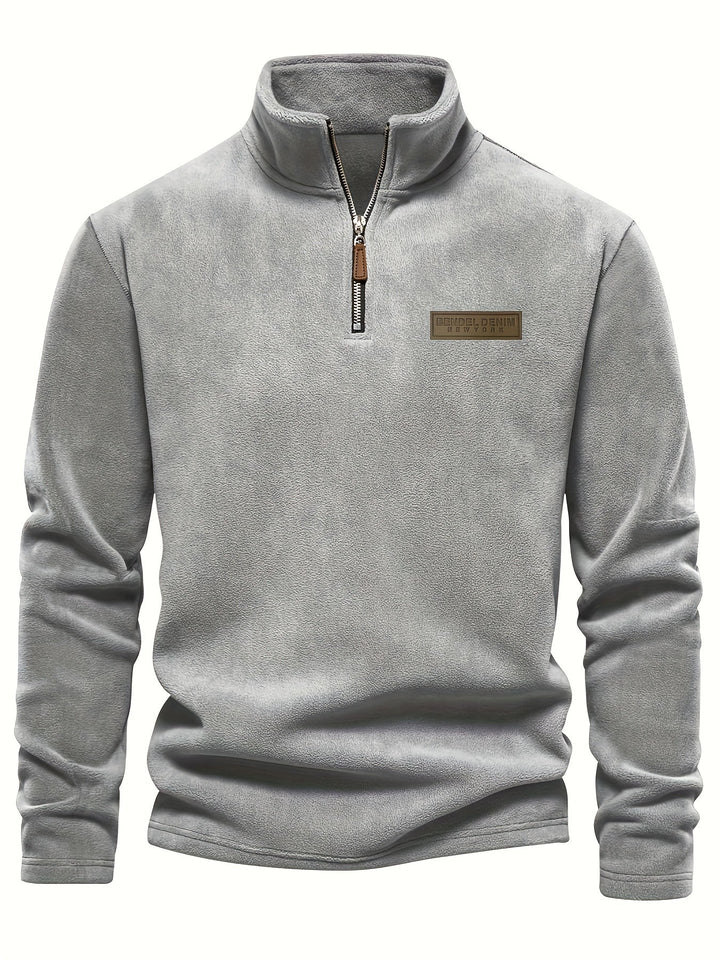 Unisex fleece-lined half-zip pullover in a cozy solid color, perfect warm layer for fall & winter outfits.