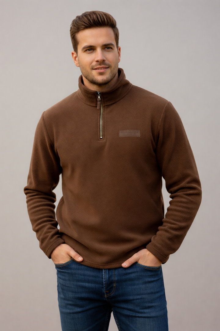 Comfortable unisex half-zip pullover, fleece-lined for extra warmth, great for casual winter and fall days.
