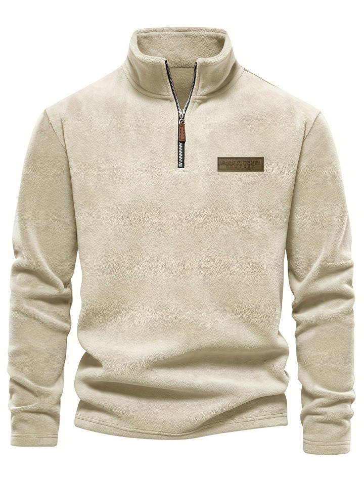 Stylish solid color half-zip pullover, fleece-lined for ultimate warmth; perfect casual essential for winter.