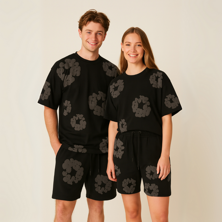 Model wearing a comfortable unisex floral tee and shorts set. Trendy summer casual outfit for women.