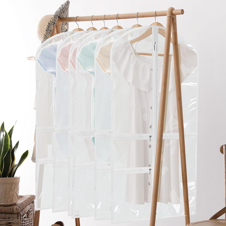 Foldable dancewear garment bags with zipped accessory pockets. Ideal for costume protection, storage & travel organization.