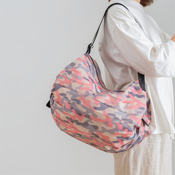 Versatile unisex foldable travel bag, large capacity, lightweight oxford fabric for trips & essentials.