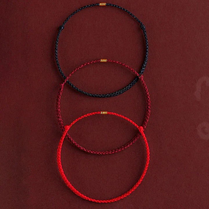 Braided cord Tibetan blessing bracelet, handmade for good fortune & harmony. Unisex adjustable spiritual accessory.