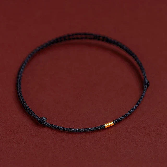 Unisex Tibetan blessing cord bracelet, handmade for harmony & good fortune. Adjustable spiritual energy jewelry.