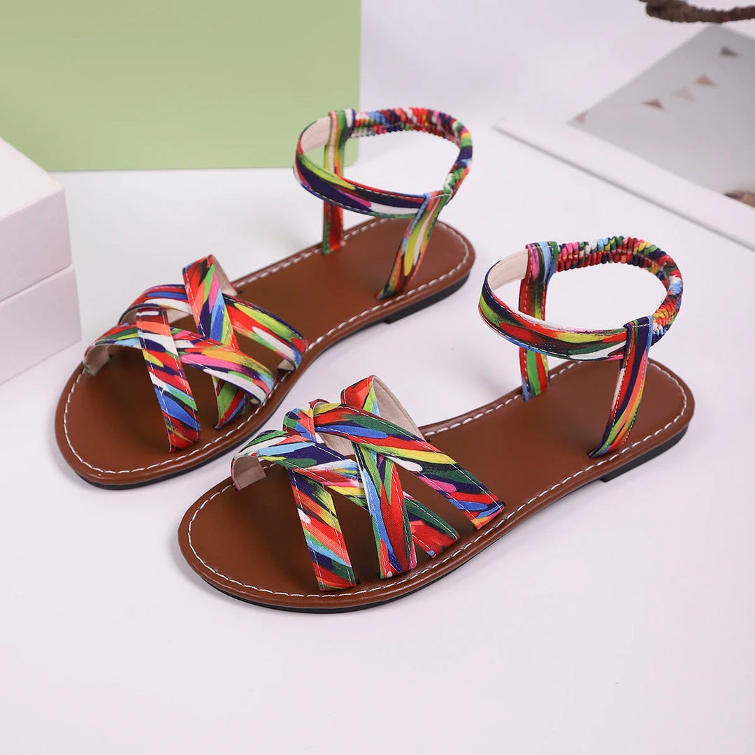 Artistic shot of unisex handmade summer strappy sandals on a wooden surface, ready for adventure