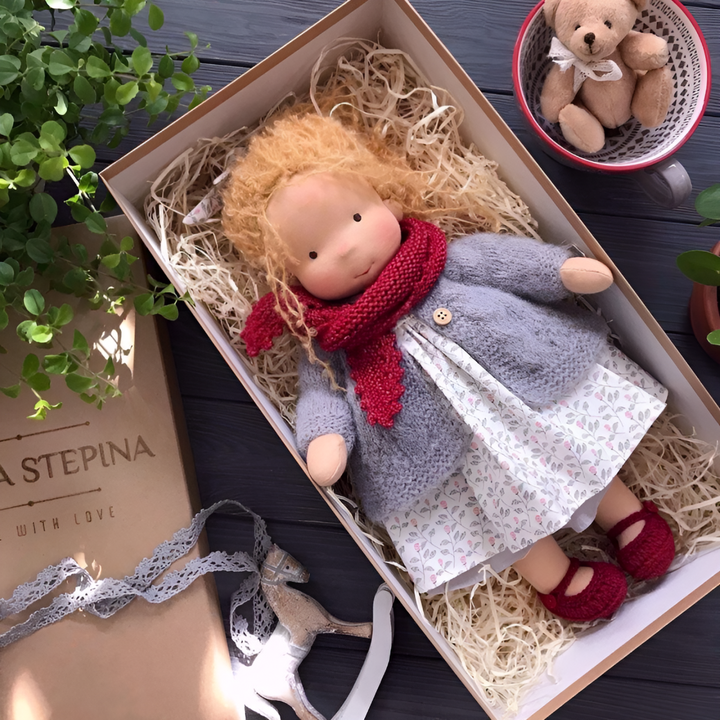 Smiling child playing with new organic Waldorf doll, fostering imagination, natural toy gift