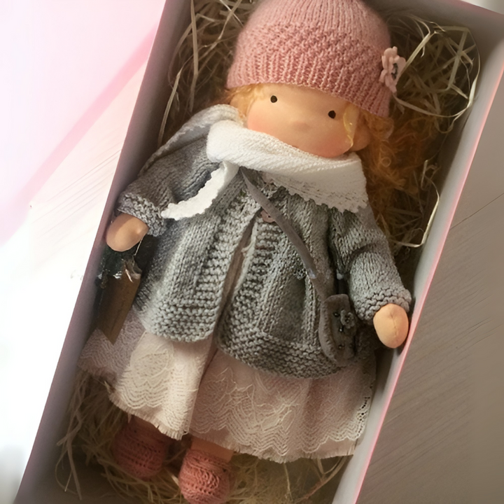 Waldorf doll held in child's hand, demonstrating size & cuddliness, a beloved companion