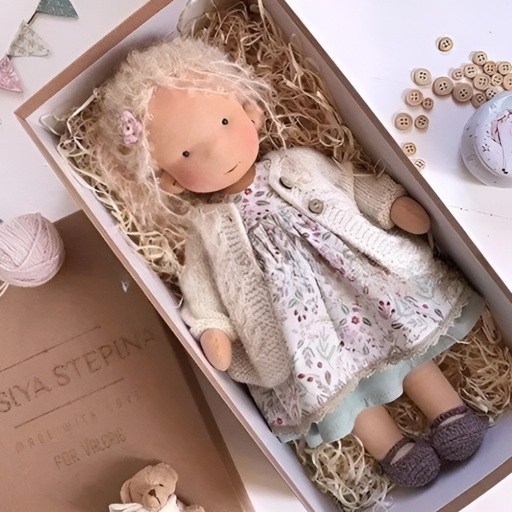 Organic Waldorf doll with simple clothing, promoting open-ended play, natural materials, wool