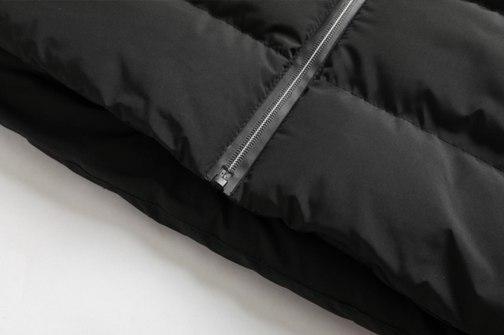 Practical unisex heated jacket, water-repellent, adjustable heat, ensuring warmth in diverse outdoor gear scenarios.