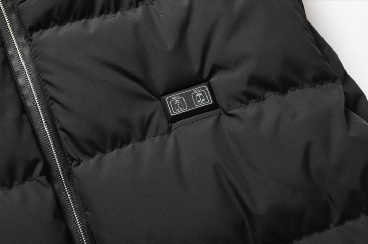 Robust unisex heated jacket, water-repellent, adjustable warmth, built for demanding cold weather conditions.