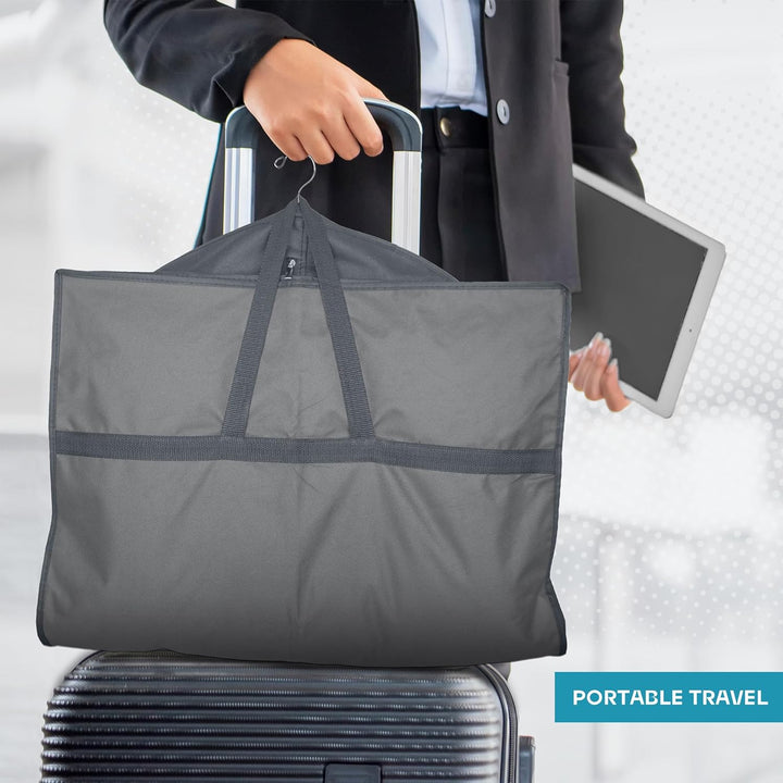 Person carrying a heavy-duty garment bag. Portable & lightweight for easy travel.