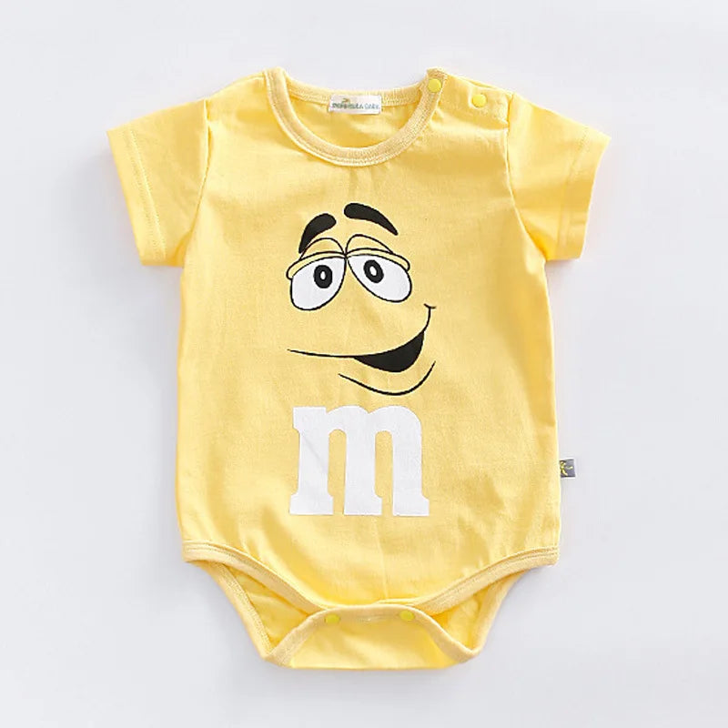 Playful M&M faces colorful print baby romper for summer. Short sleeve infant jumpsuit, unisex toddler outfit.