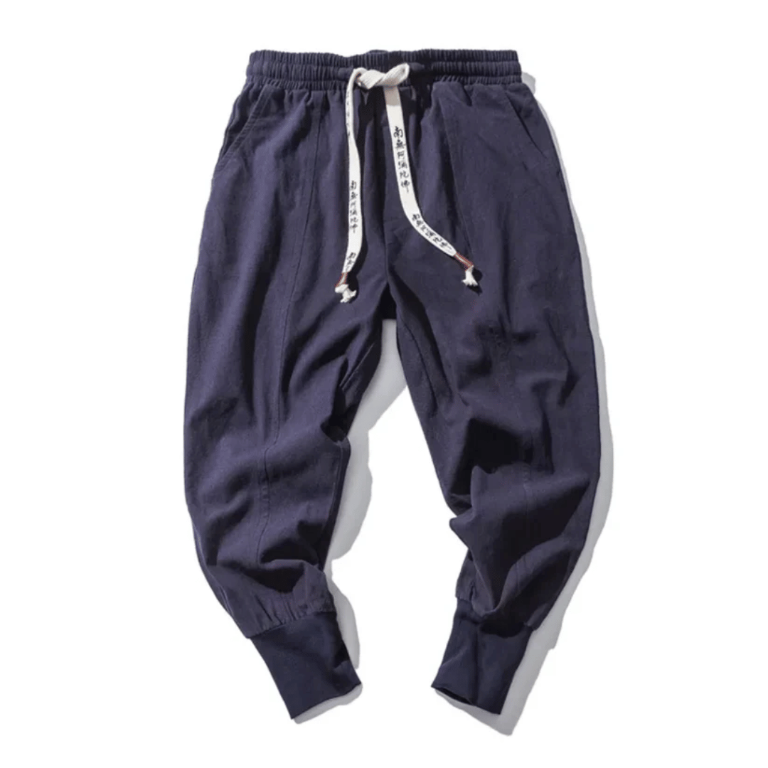 Unisex Japanese style relaxed fit tapered pants for casual or street style wear. Comfortable drawstring design.