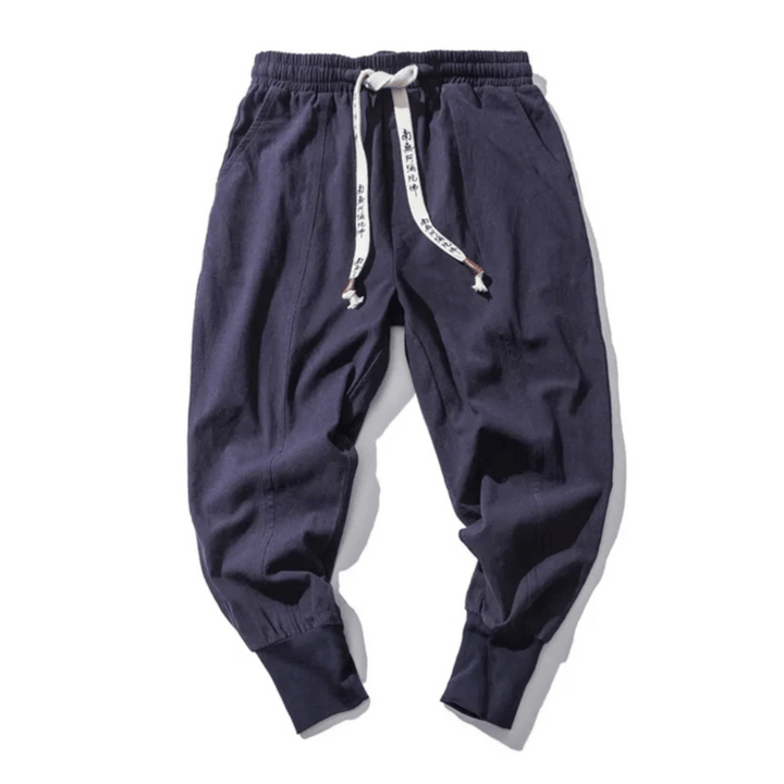 Unisex Japanese style relaxed fit tapered pants for casual or street style wear. Comfortable drawstring design.