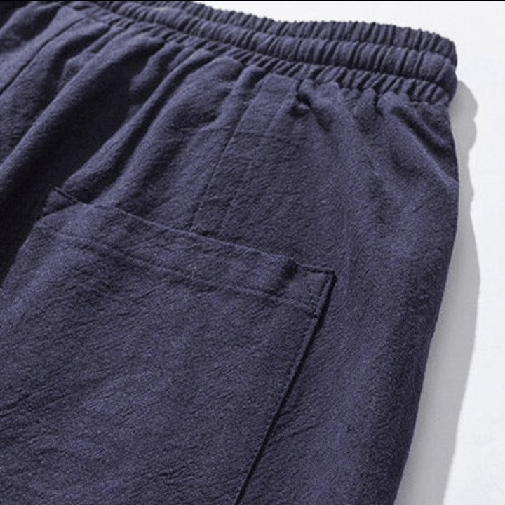 Navy blue unisex Japanese style tapered pants, relaxed fit for comfort & modern fashion street style.