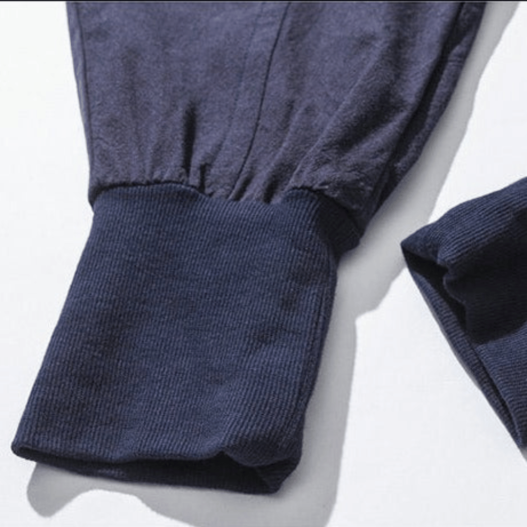 Black unisex Japanese style drawstring pants, relaxed fit with tapered leg, perfect for casual street style.