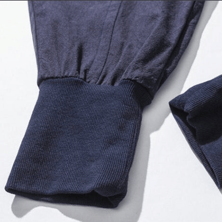 Black unisex Japanese style drawstring pants, relaxed fit with tapered leg, perfect for casual street style.