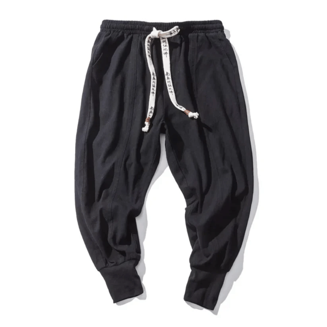 Red unisex Japanese style relaxed fit tapered pants, comfortable and versatile for modern casual wear.