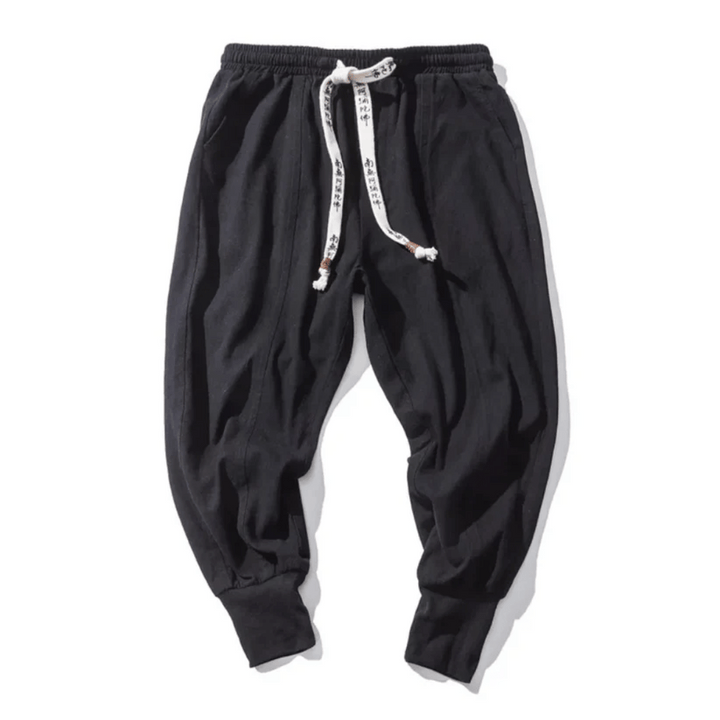 Red unisex Japanese style relaxed fit tapered pants, comfortable and versatile for modern casual wear.