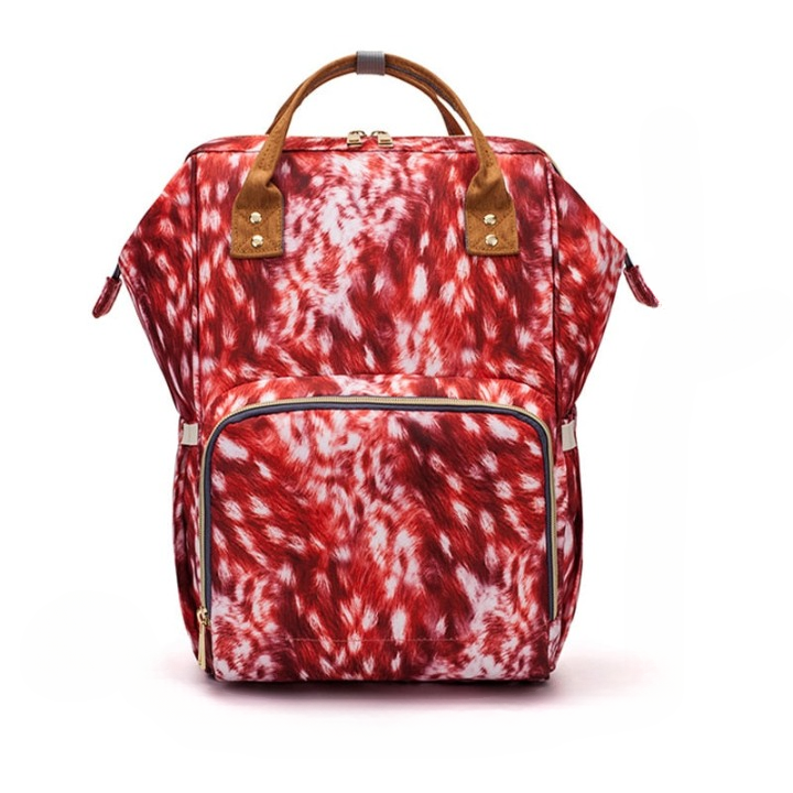 New parent carrying a stylish unisex waterproof diaper backpack, organized for baby essentials & travel.