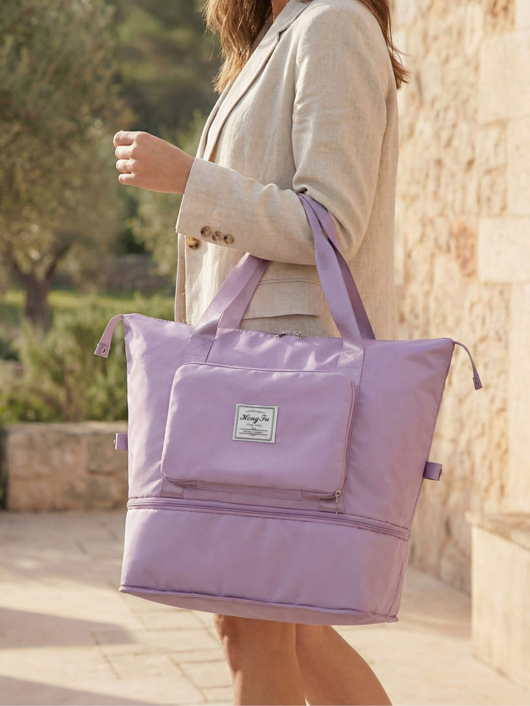 Lightweight expandable weekender travel bag, shown fully expanded, ideal for extra storage.