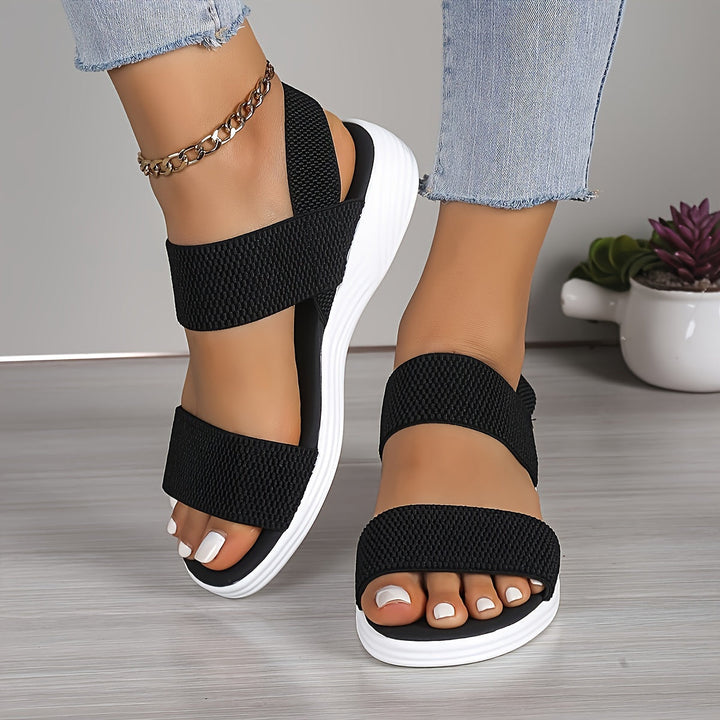 Pair of unisex red orthopedic comfort sandals, adding a pop of color to summer outfits.