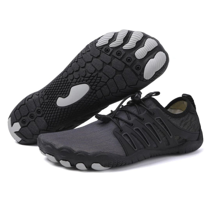Side view of a lightweight barefoot fitness shoe, black, designed for natural foot flexibility