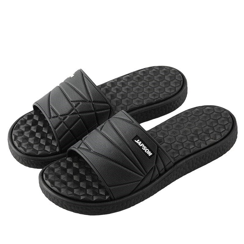 Close-up of a unisex slipper showcasing its orthopedic arch support design.