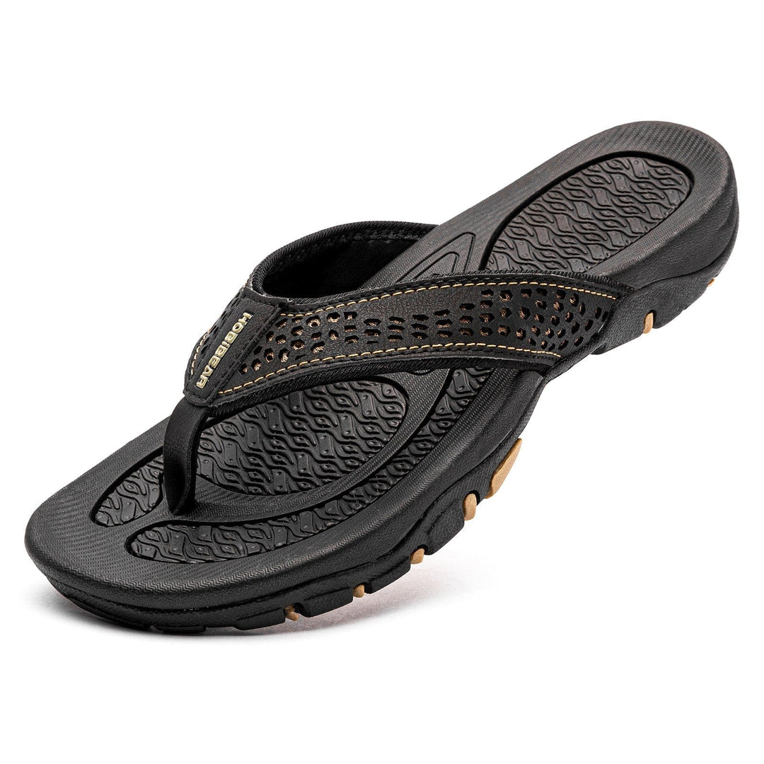 Pair of breathable orthopedic slippers with arch support, perfect for home use.