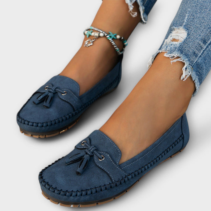Unisex orthopedic support loafers in a neutral color, providing all-day comfort and arch support.