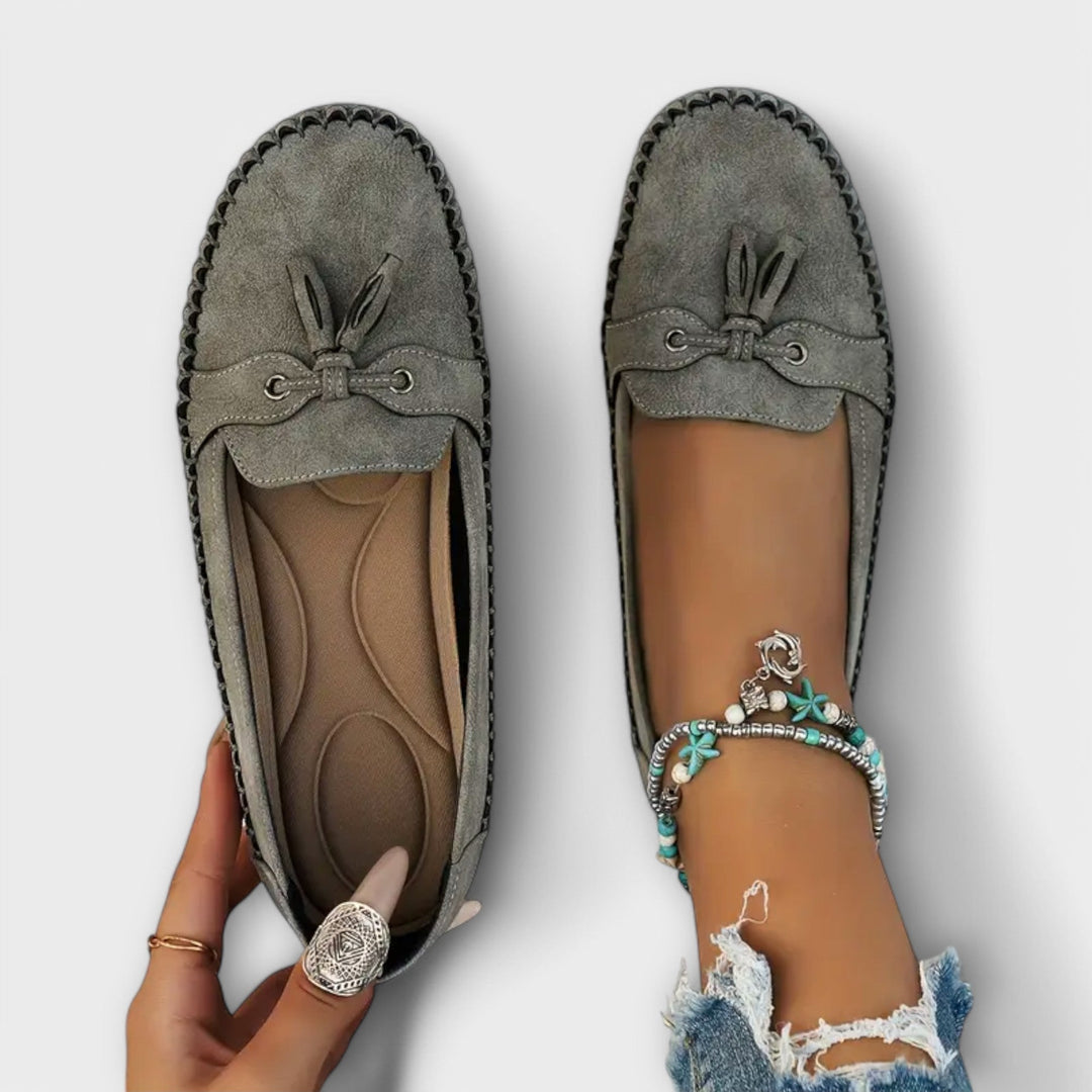 Footwear image showcasing comfortable unisex slip-on loafers with orthopedic support for daily wear.