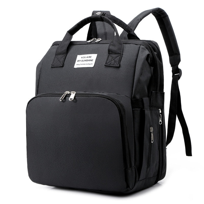 Unisex portable baby bed & diaper bag backpack, ideal for travel.