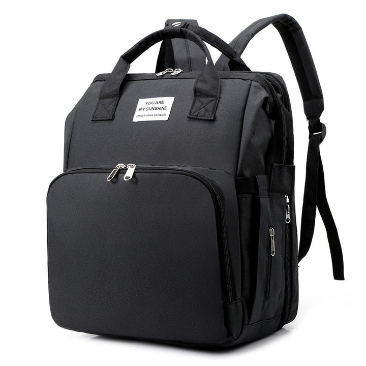 Unisex portable baby bed & diaper bag backpack, ideal for travel.