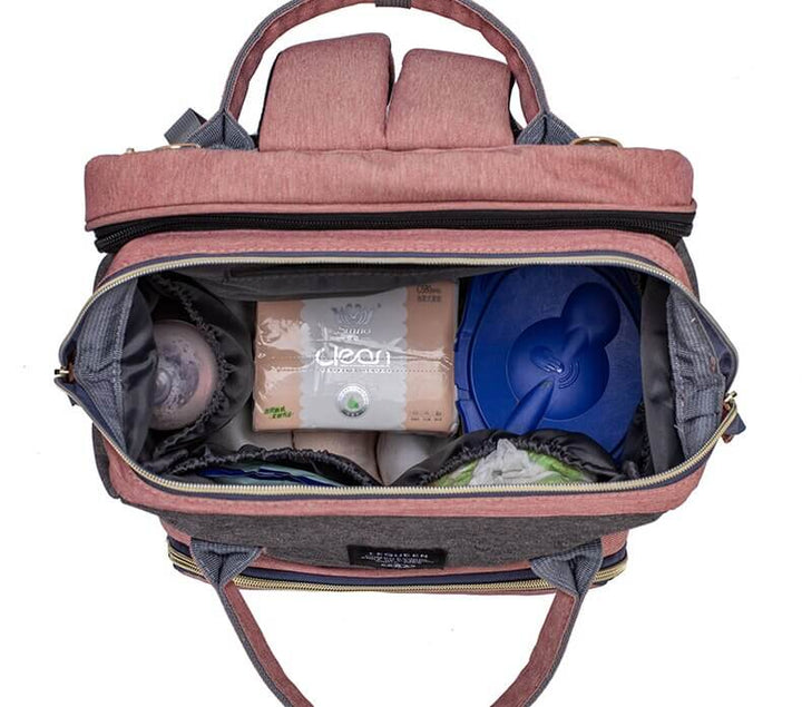 Unisex portable baby bed & changing station travel backpack for parents.