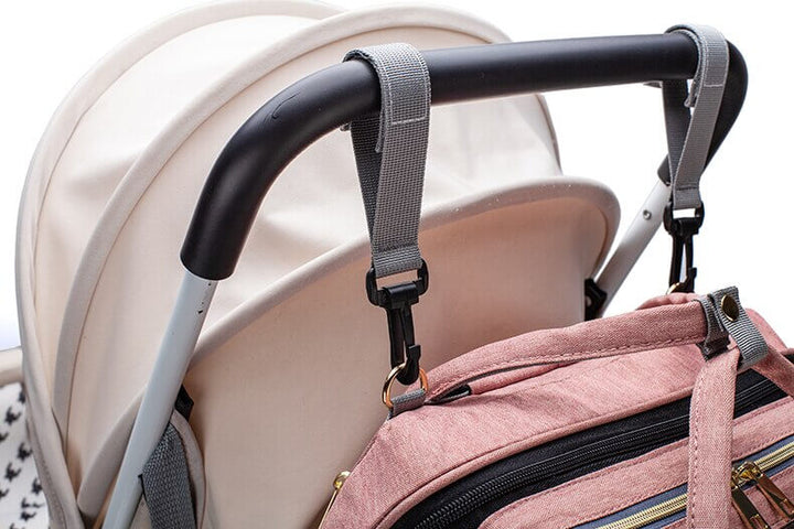 Convenient baby gear: waterproof diaper bag, travel bassinet & backpack.