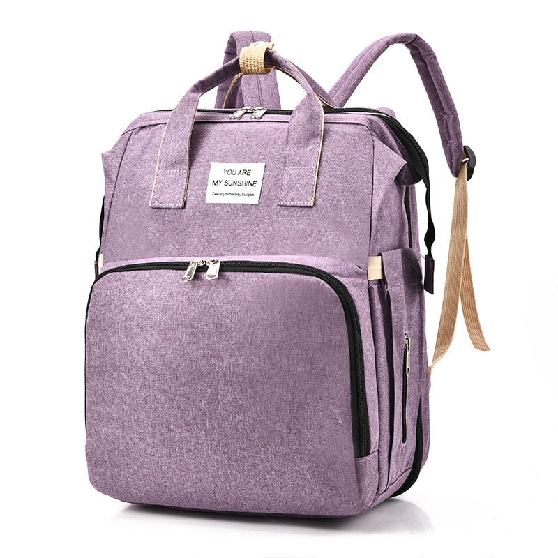 Infant travel backpack with built-in bed; a versatile parent essential.