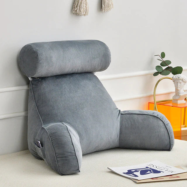 Unisex reading bed pillow with supportive arms & memory foam for ultimate back & arm comfort while lounging.