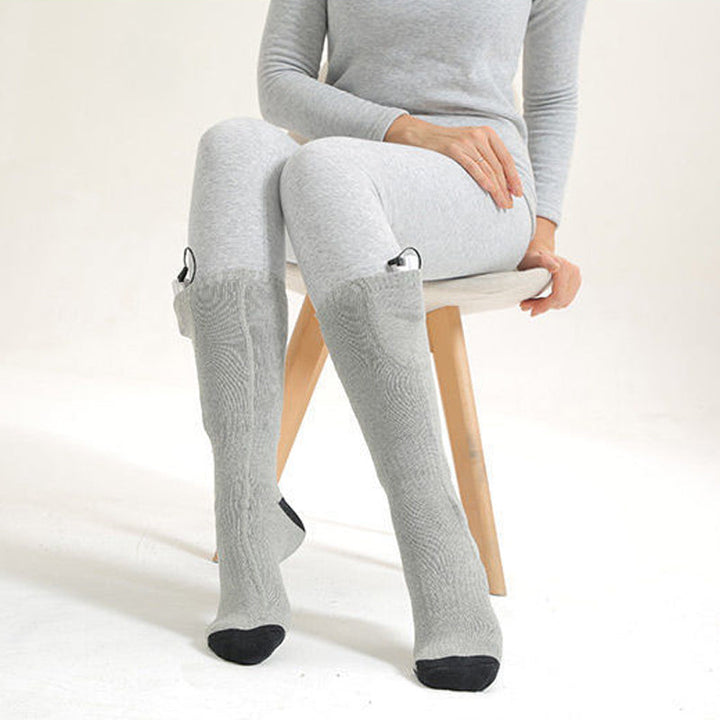 Plush thermal heated socks, rechargeable for luxurious winter comfort & ultimate foot warmth.