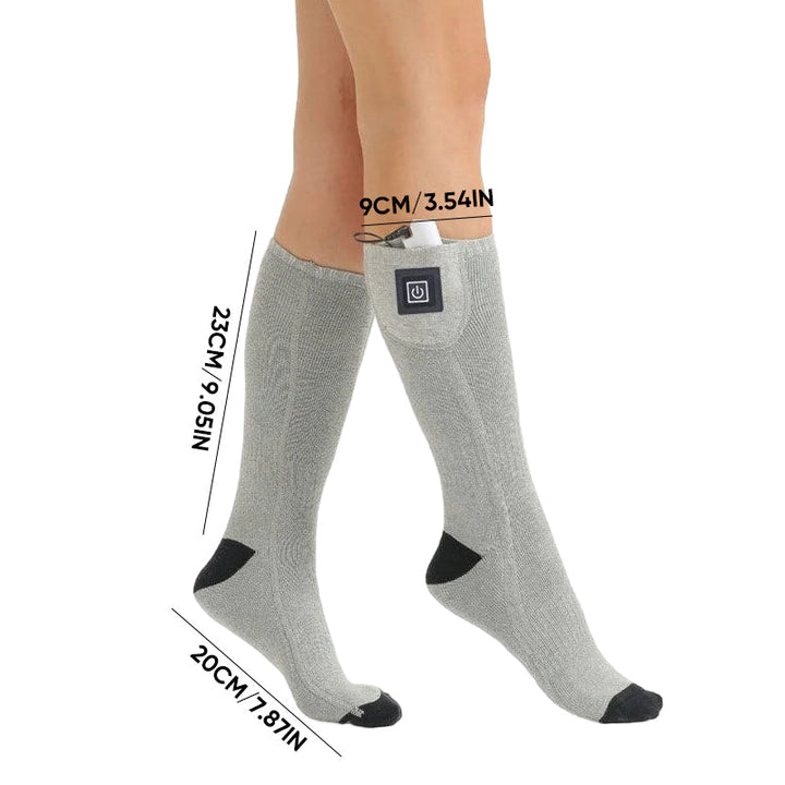 Person wearing unisex rechargeable heated socks, showcasing warmth & comfort in winter.