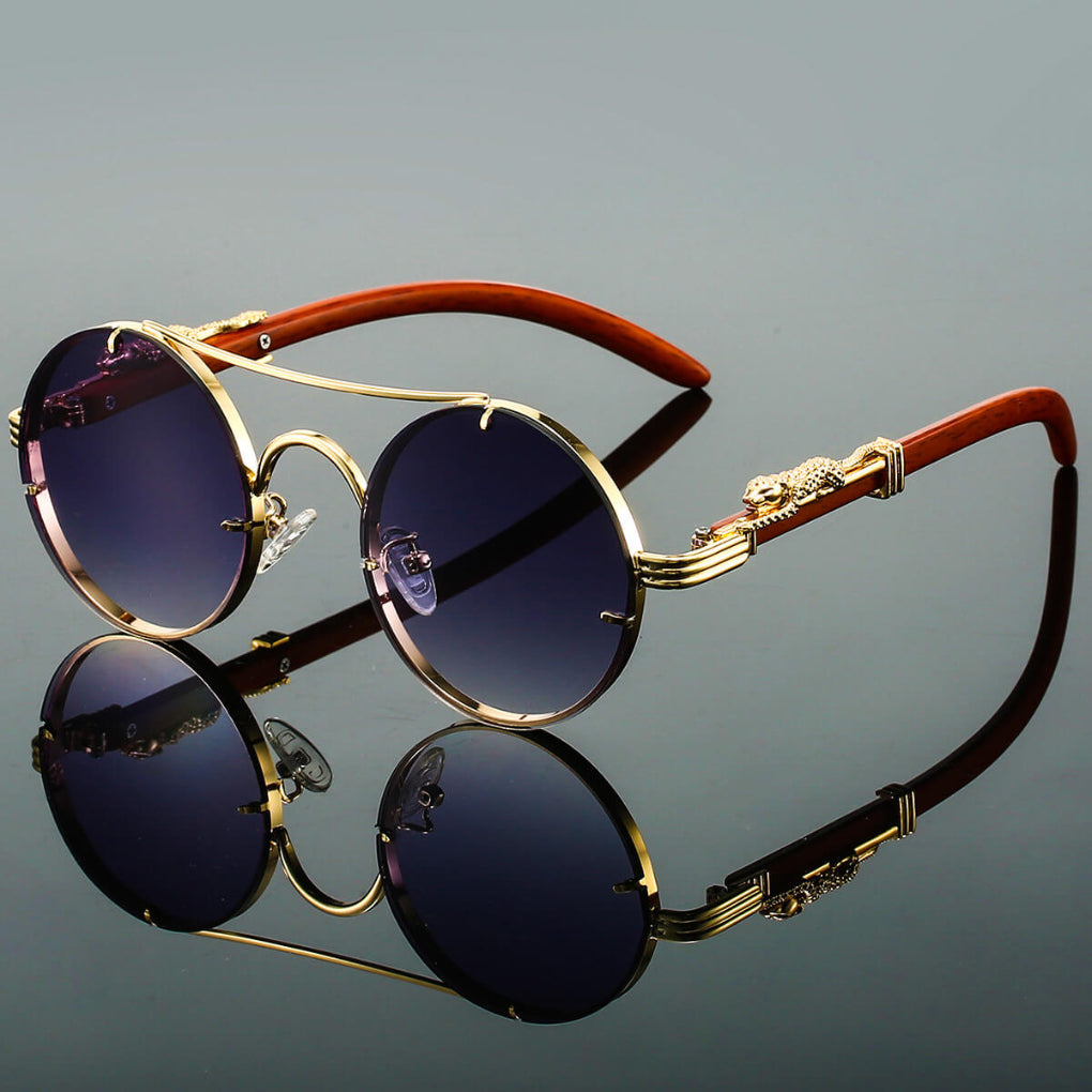 Pair of black oval metal frame sunglasses, new vintage-inspired design for men and women.