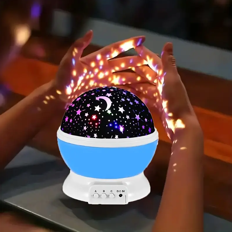Rotating star projector night light for kids' room decor, creating a magical celestial bedroom experience.