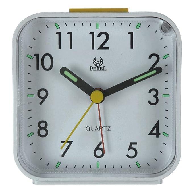 Quiet bedside alarm clock with snooze, illuminated dial for night viewing. Battery operated, ideal for travel and bedroom.