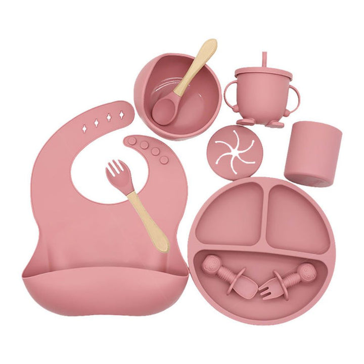 Unisex silicone baby feeding set with suction bowl, adjustable bib, & spoon for safe, mess-free baby-led weaning.