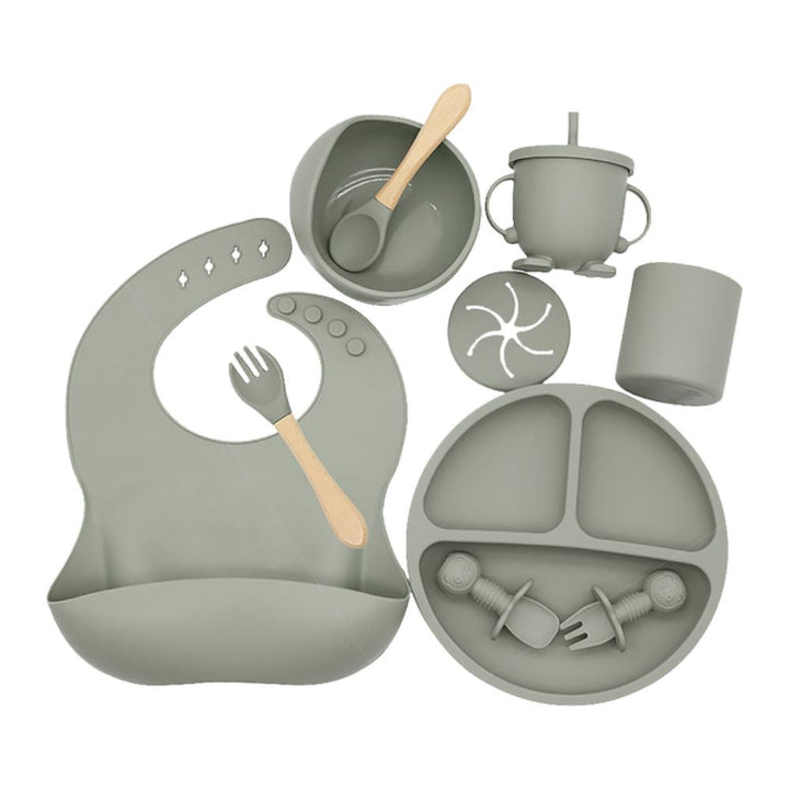 No-mess silicone baby feeding set with strong suction bowl to prevent spills. Includes a comfortable, adjustable bib for infants.