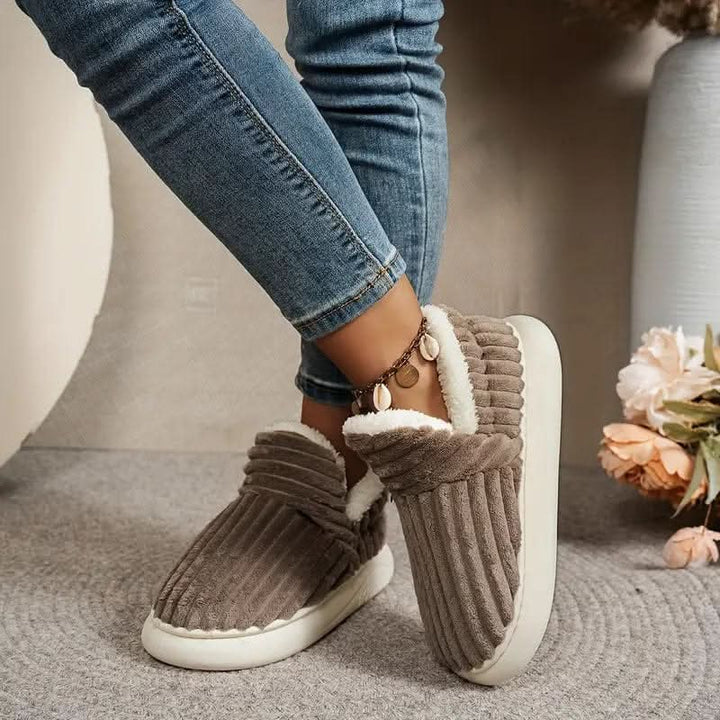 Plush thermal unisex slippers with soft lining, offering supreme warmth & comfort indoors.