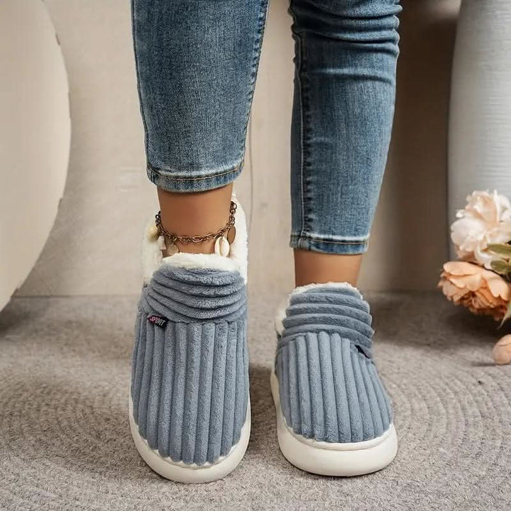 Warm thermal house shoes for men and women, non-slip design, perfect for cozy indoor living.