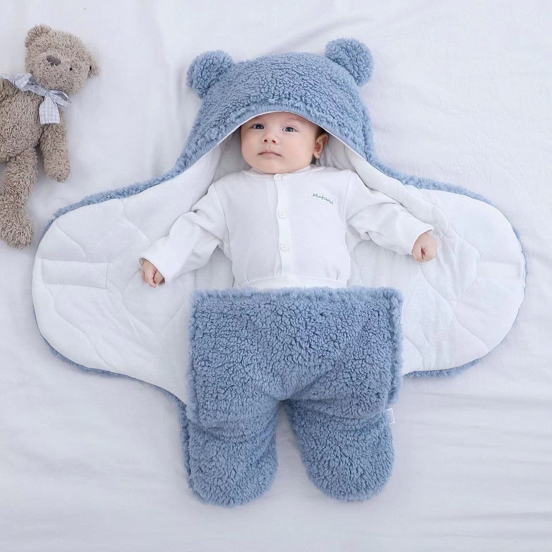 Plush, ultra-soft baby swaddle in quilted fabric. Cozy infant sleepsack for comfortable newborn sleep.