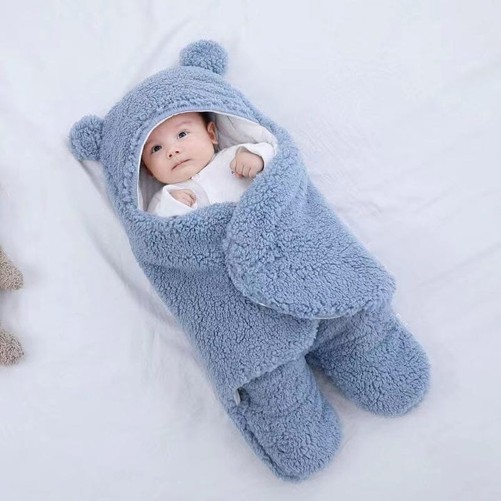 Cute unisex baby swaddle with playful bear ears. Quilted design keeps newborns warm & cozy during winter.