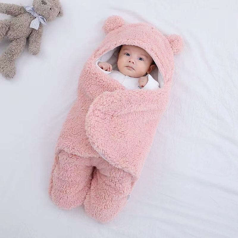 Unisex quilted baby swaddle, ultra-soft plush material. Cozy sleepsack for newborns, features cute bear ears.